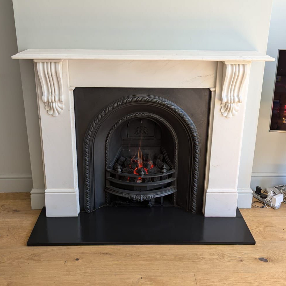 White marble "Corbel" mantel, original arch insert, gas fire